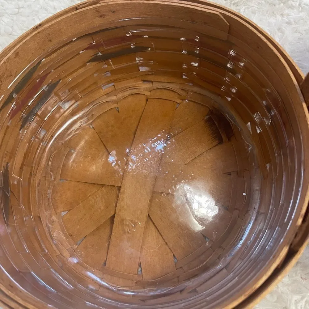 Longaberger 1995 set of two Handcrafted round and Square Woven baskets .